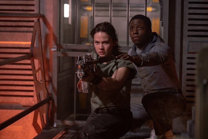 Andy holds onto Rain's shoulder in Alien: Romulus.