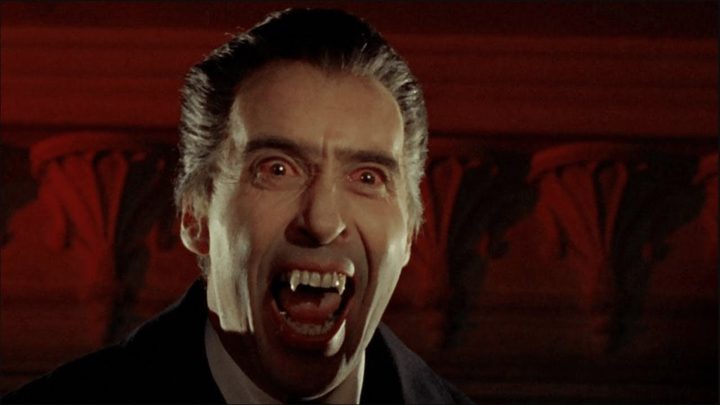Christopher Lee as Dracula bearing his fangs in Dracula: Prince of Darkness.