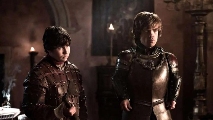Daniel Portman and Peter Dinklage as Podrick Payne and Tyrion Lannister looking in the same direction in Game of Thrones.