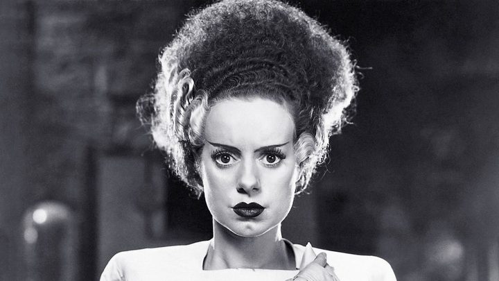 Elsa Lanchester as The Bride looking directly at the camera in Bride of Frankenstein.