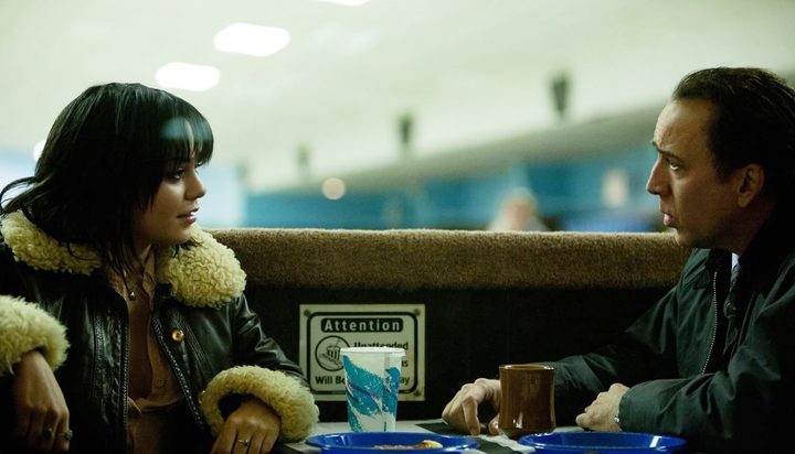 A man and a woman talk in The Frozen Ground.