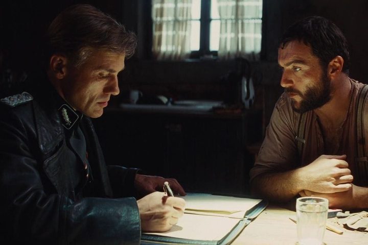 Hans Landa takes notes in Inglourious Basterds.