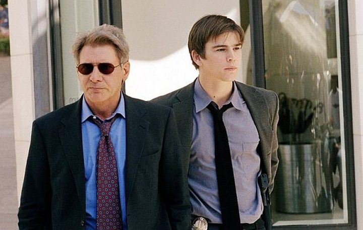 Two men walk in Hollywood Homicide.