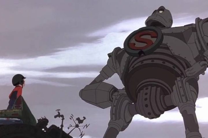 Hogarth Hughes looks up at the Iron Giant.