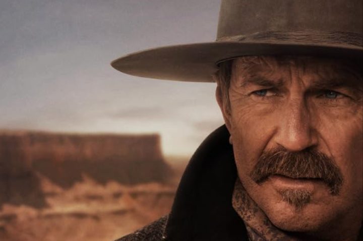 Kevin Costner stares to his right.