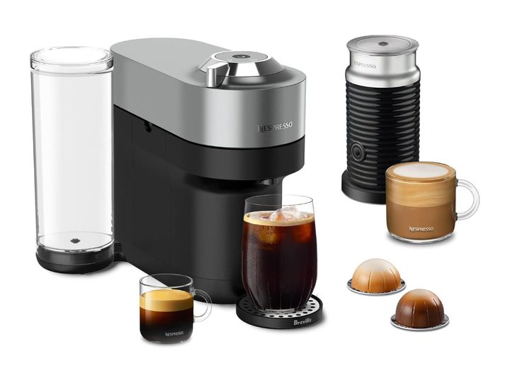 The Nespresso Vertuo POP+ Deluxe Coffee and Espresso Machine and accessories against a white background.