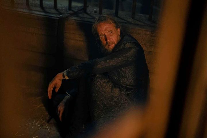 Otto Hightower sits in a cage in House of the Dragon season 2.