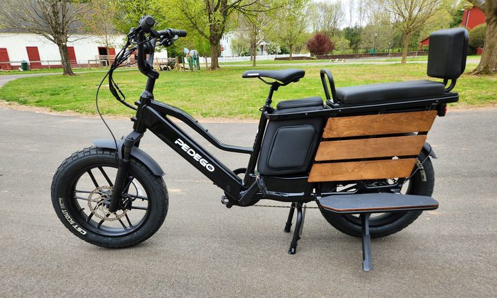 Pedego Cargo on the center stand wih the kick stand extended - each has its purpose.