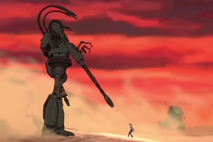 The Iron Giant points a laser cannon at Hogarth Hughes.