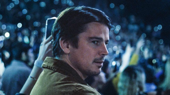 Josh Harnett surveys a concert hall in a still from the movie Trap.