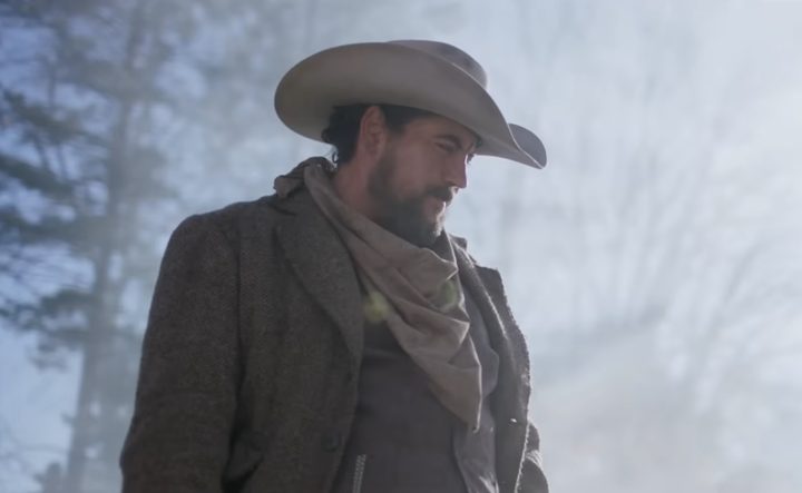 A man in a cowboy hat looking down in "Wyatt Earp and the Cowboy War."