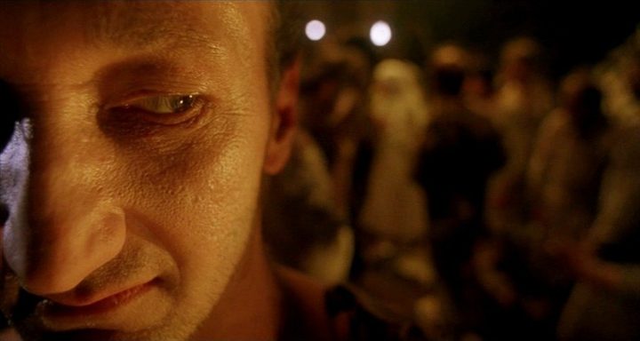 A man looks back at a crowd in A Nightmare on Elm Street 5: The Dream Child.