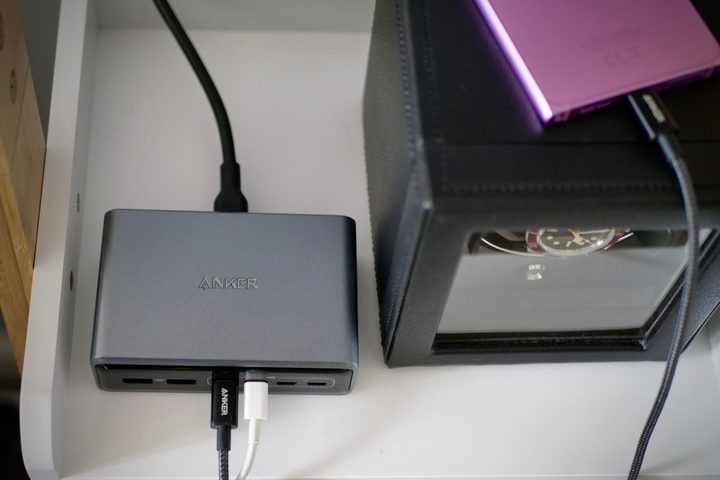 The Anker Supercharged Multi-port Desktop Charging Station charging a phone.