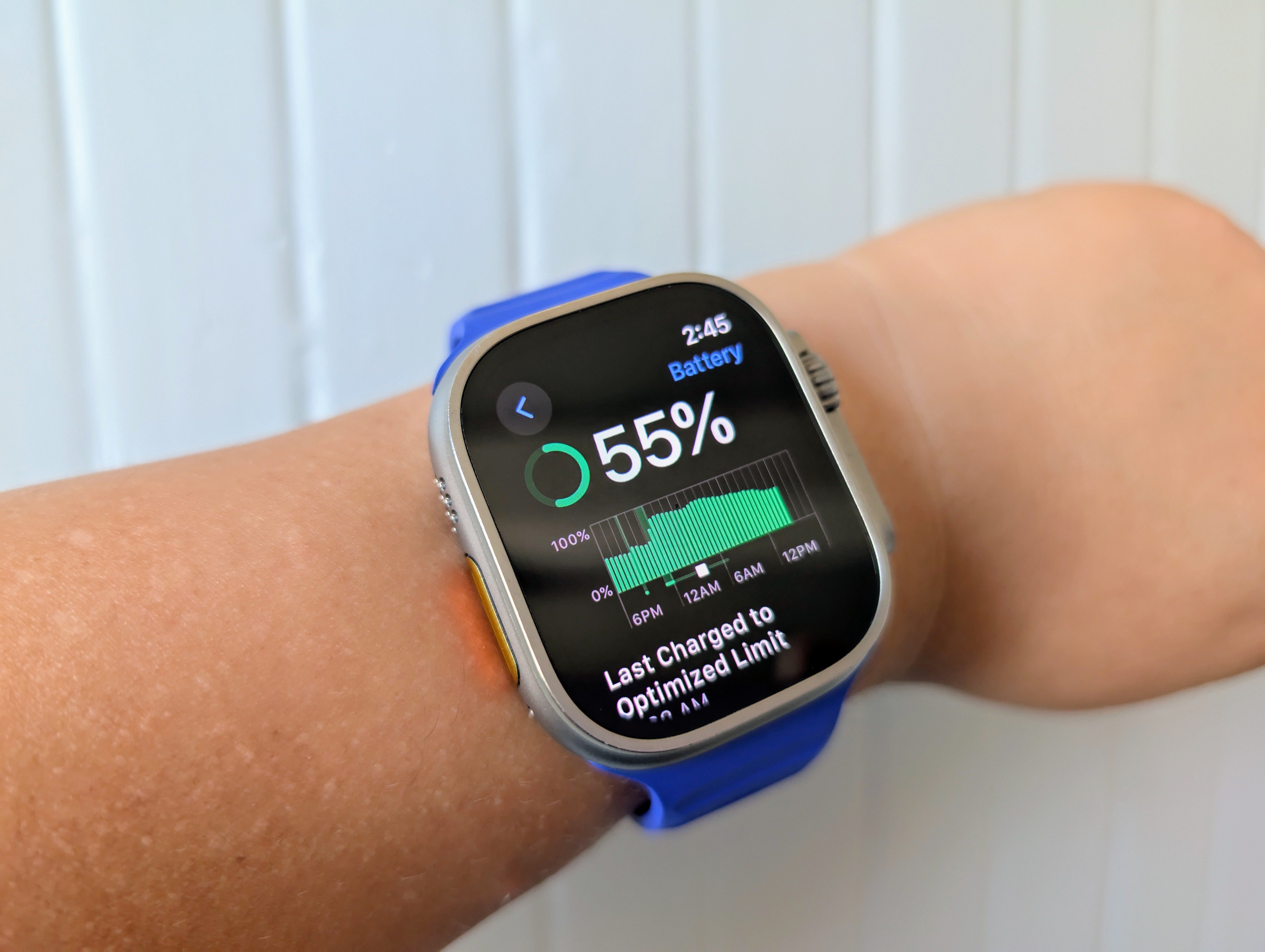 Someone wearing an original Apple Watch Ultra showing the battery.
