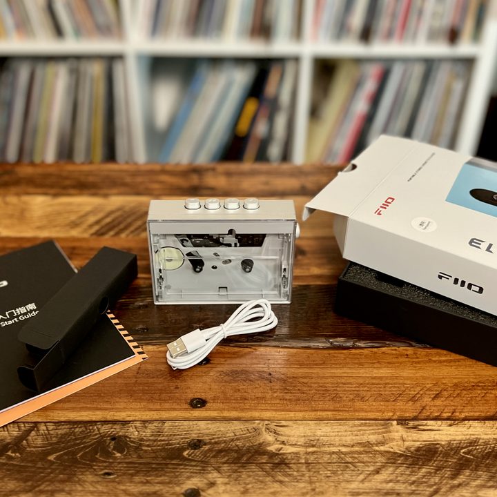 The Fiio CP13 portable cassette player, USB-C cable, its box, and Quick Start Guide.