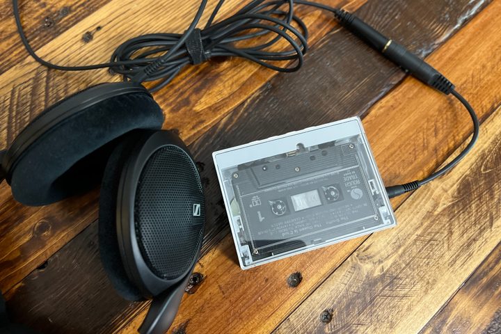 The Fiio CP13 portable cassette player with a pair of Sennheiser headphones.