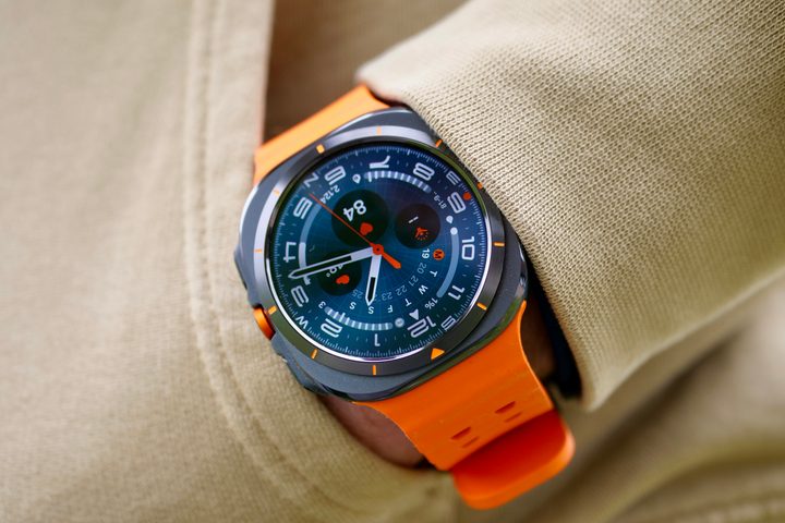 A person wearing the Samsung Galaxy Watch Ultra showing the Ultra Analogue watch face.