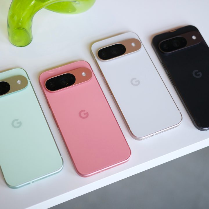 The Google Pixel 9 in green, pink, white, and black colors, all laying on a white table.