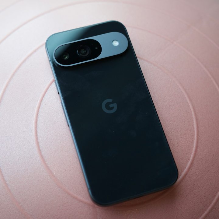 A black Google Pixel 9 laying face-down on an exercise ball.