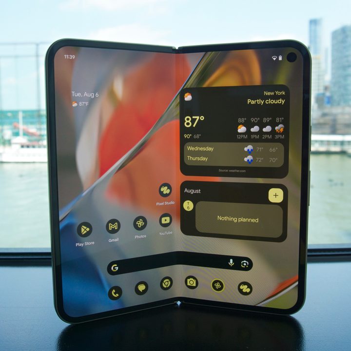 The Google Pixel 9 Pro Fold with its inner display on, showing the home screen.