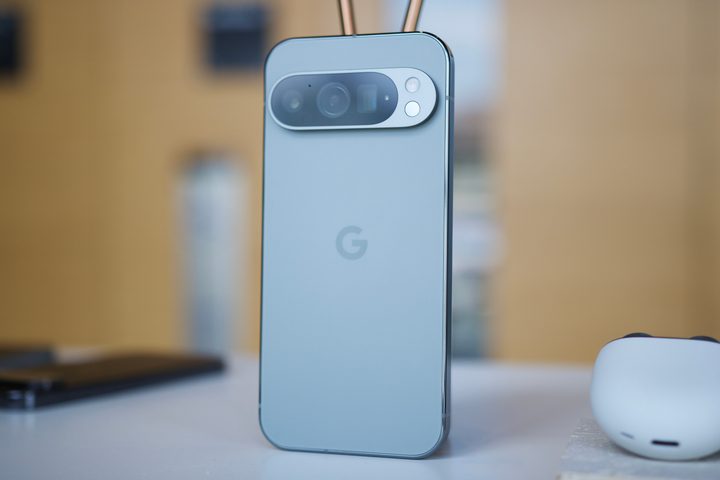 The Google Pixel 9 Pro standing upright on a table.