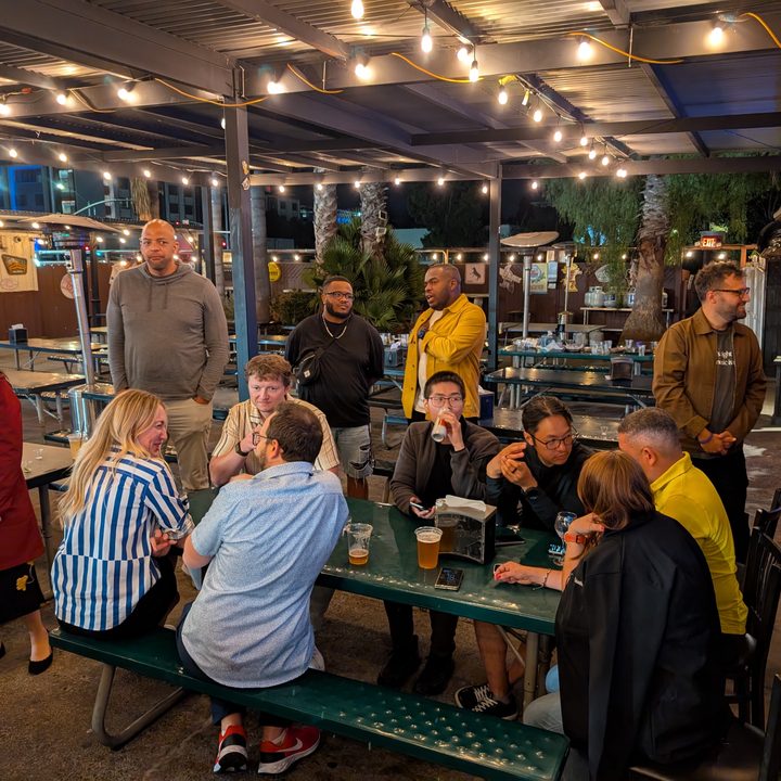 A photo of people at an outdoor bar at night, taken with the Google Pixel 9 Pro XL.