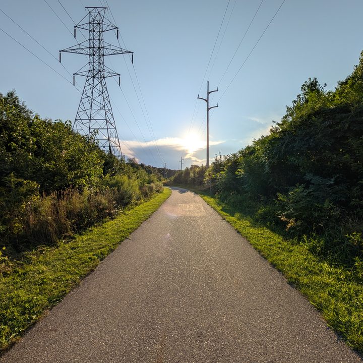 A photo of a nature trail with a sunset in the background, taken with the Google Pixel 9 Pro XL.