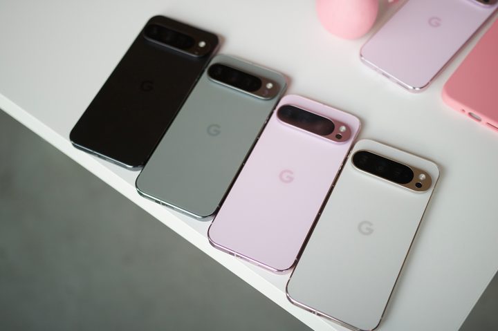 All four colors of the Google Pixel 9 Pro XL laying next to each other on a white table.