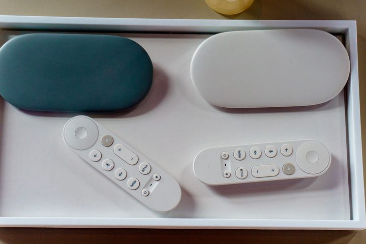 The two colors of Google TV Streamer — hazel and porcelain — with their remote controls.
