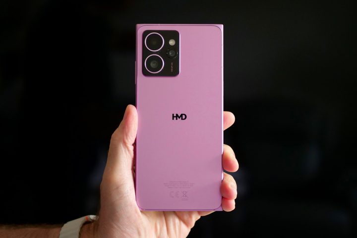 A person holding the HMD Skyline, showing the back of the phone.
