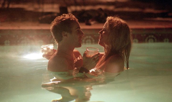A man and a woman embrace in a pool in Laurel Canyon.