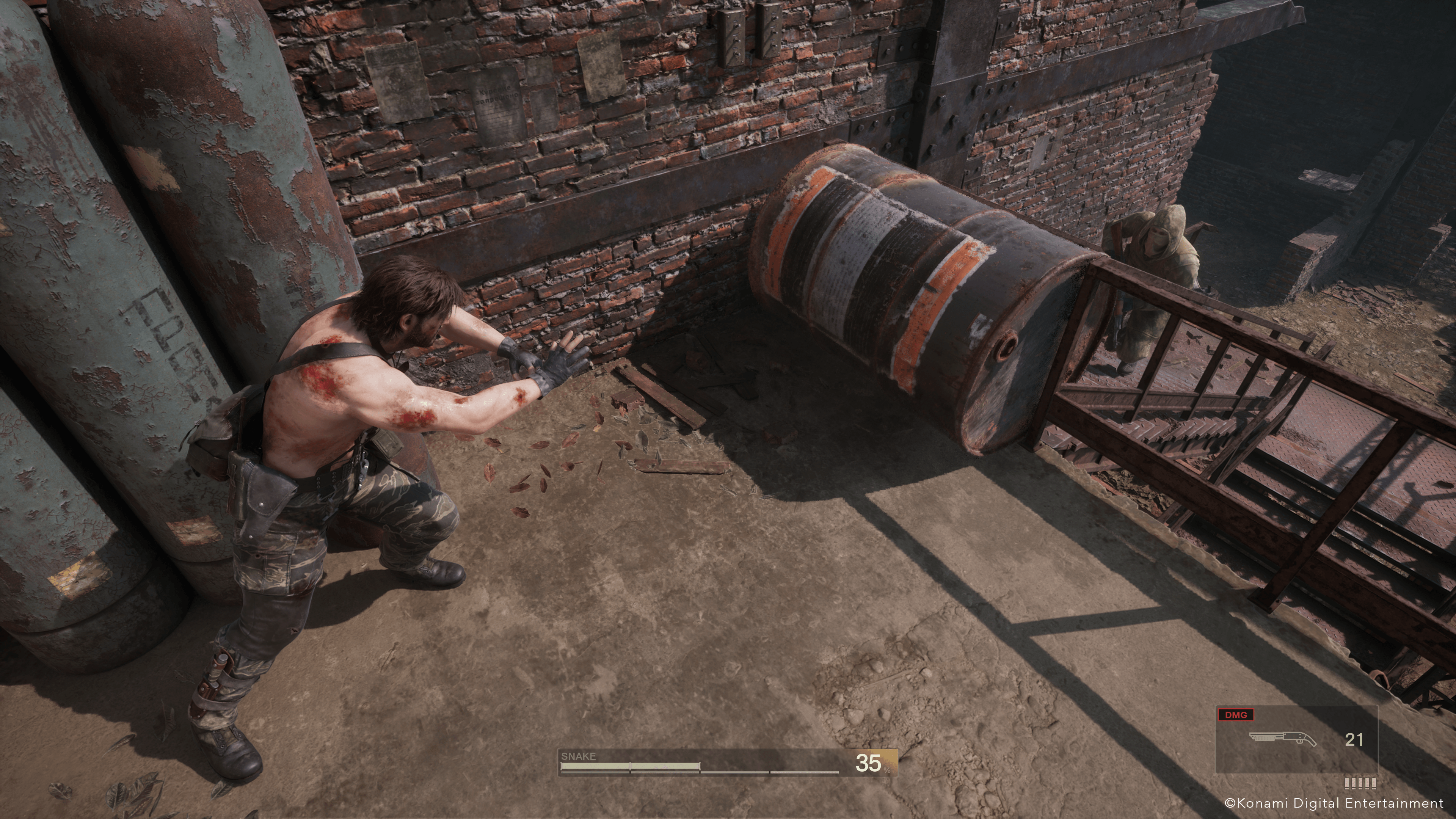 Snake next to a barrel.