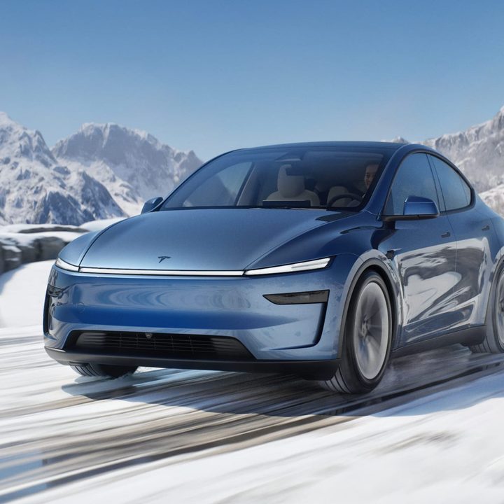 Blue Tesla Model Y Juniper in the snow