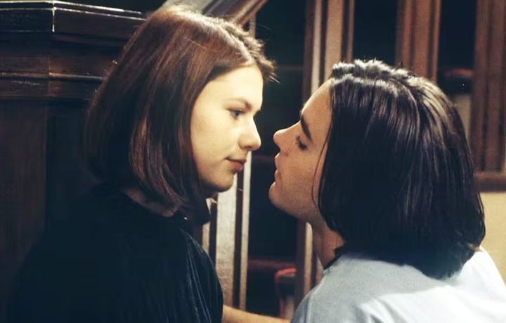 A teenaged boy is about to kiss a girl in My So-Called Life.