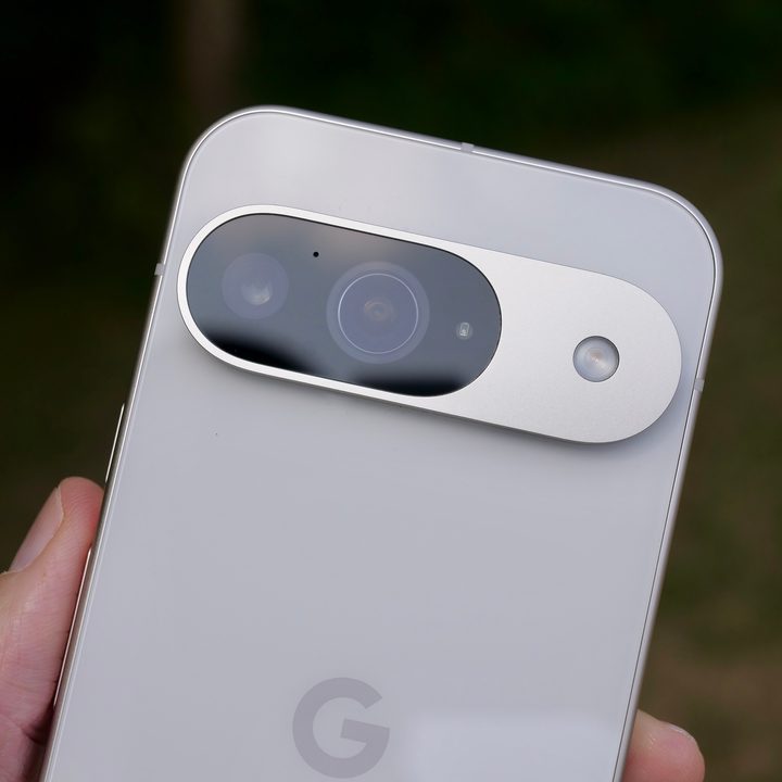 A person holding the Google Pixel 9, showing the camera.