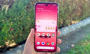 Pixel 9 Pro in Rose Quartz showing home screen.