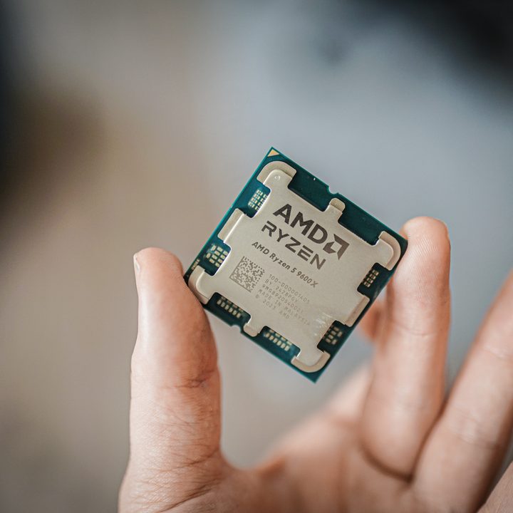 The AMD Ryzen 5 9600X between two finger tips.