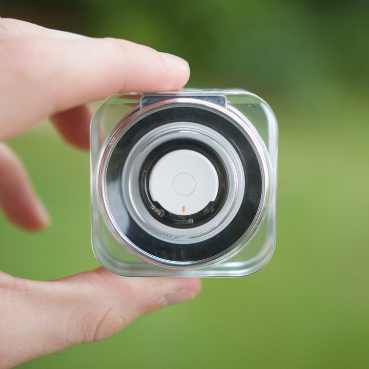The Samsung Galaxy Ring in its charging case.