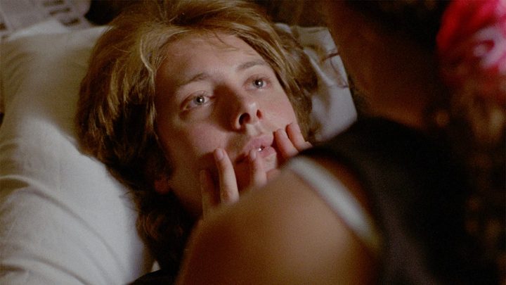A man looks up at a woman in sex, lies, and videotape.