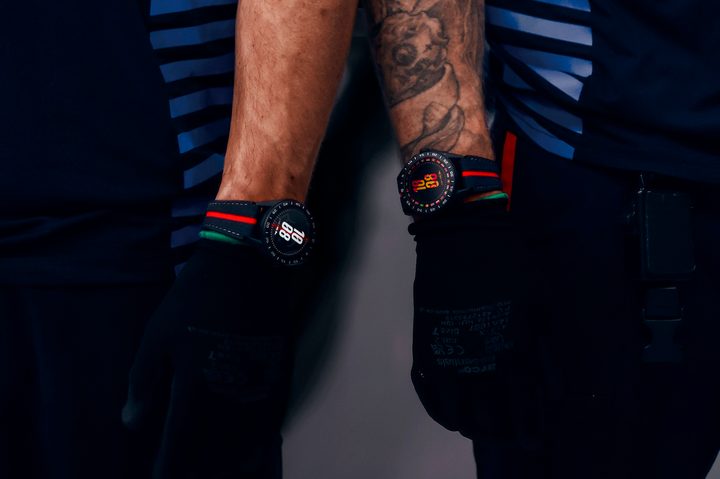 The Tag Heuer Connected Calibre E4 x Oracle Red Bull Racing Edition on wrists.