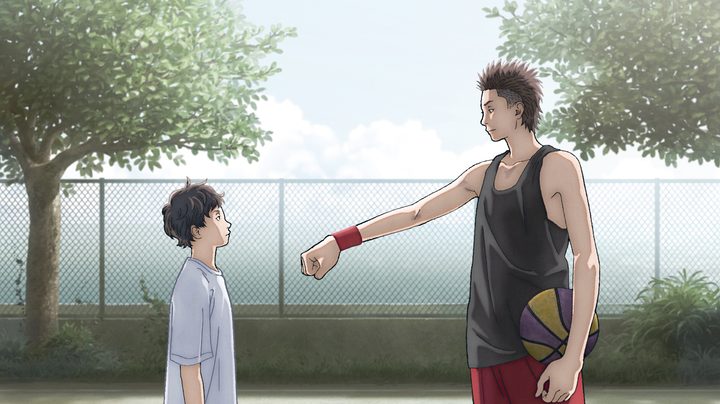 A man fist bumps a young boy in The First Slam Dunk.