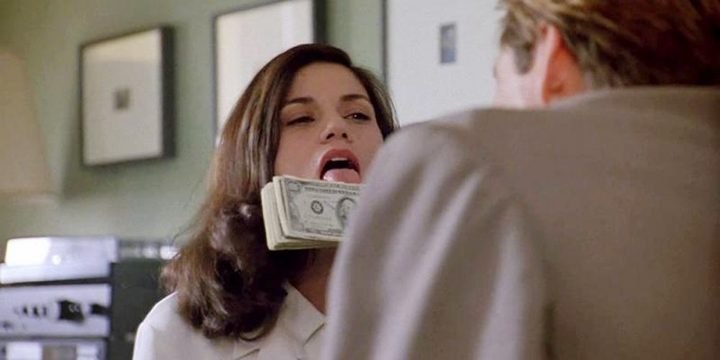 A woman licks a stack of bills in The Last Seduction.