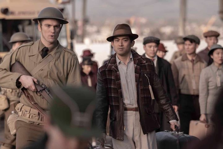 A man is escorted by a soldier in The Terror season 2.