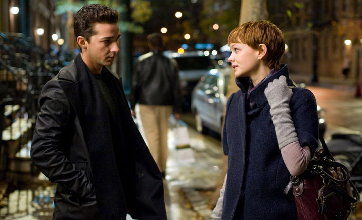 A man and a woman talk in Wall Street: Money Never Sleeps.