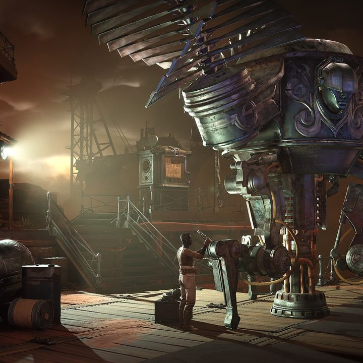 A large robot-looking machine in the middle of a room. There are two people working on it.