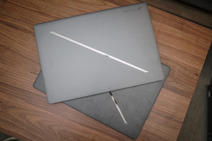 Two Zephyrus G16 laptops sitting on top of each other.