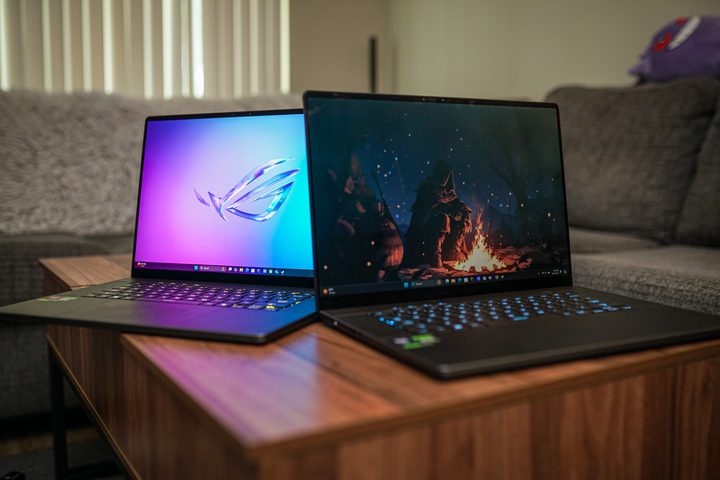 Two Zephyrus G16 laptops sitting next to each other.