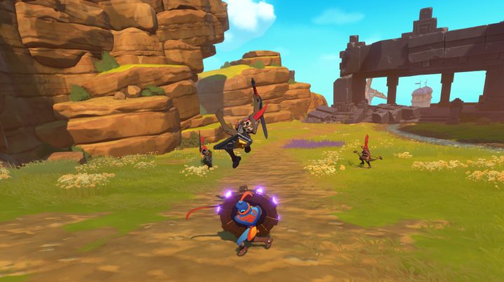 The small shape of the Knightling hides behind his round shield as a sword wielding enemy jumps in with an attack in The Knightling.