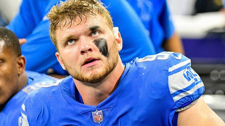 Aidan Hutchinson of the Detroit Lions sits down and stares.