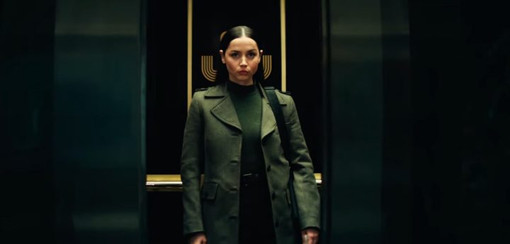 Ana de Armas stands in an elevator.